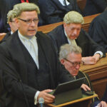 Photo of Richard Atkins QC, Chair of the Bar, standing, and Simon Davis, President-Elect of the Law Society, seated.