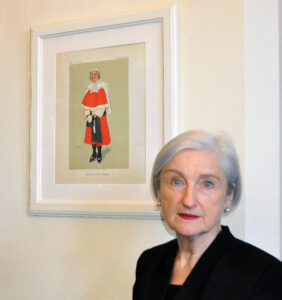 Lady Justice Nicola Davies with a picture of her in her robes, drawn by court staff
