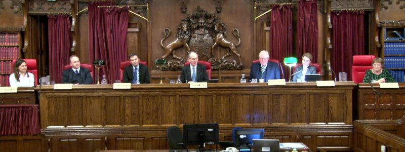 Panel of speakers sitting in court. From left to right: Dr Sheena Webb -Consultant Clinical Psychologist (speaking on behalf of person with lived experience), Michael Horton KC -Barrister, Dr Andy Hayward -  Professor at Durham Law School, Sir Andrew McFarlane -President of the Family Division and Chair of the Family Justice Council, Sir Paul Coleridge -Chair of the Marriage Foundation and retired High Court Judge, Elizabeth Darlington MCIArb - Barrister, Professor Rebecca Bailey-Harris –Barrister.