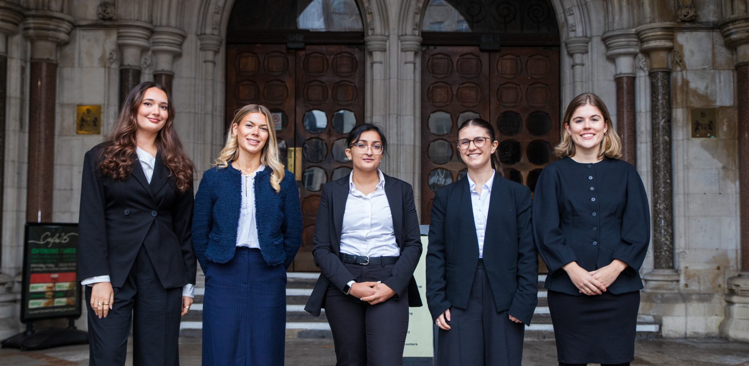Amber Mason, Mali Pink, Amn Bashir, Ella Mennecillo, Hannah Williams outside the Royal Courts of Justice