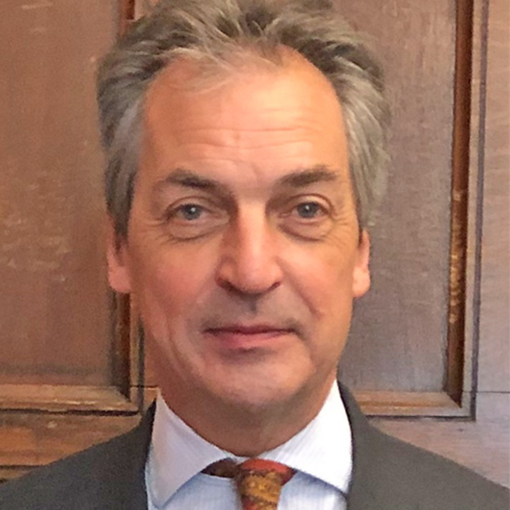 Lord Justice Warby, wearing a suit